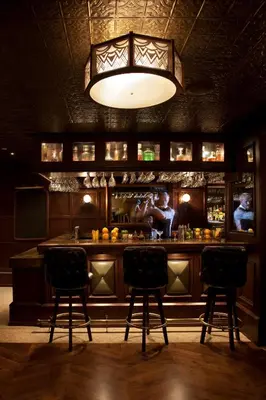 a bar with two chairs in front of it at The Hollywood Roosevelt in Los Angeles