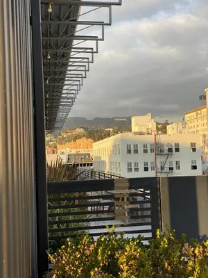 a view of a city from a balcony of a building at THE MIDNIGHT LOFT BY BOBOU DESIGN (KING SUITE) in Los Angeles