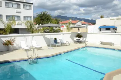 a swimming pool on the roof of a building at Pasadena Rose & Crown Hotel in Pasadena