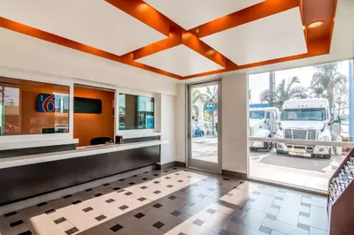 a lobby with a large glass door and a truck at Motel 6 Bell Gardens, CA - Los Angeles in Bell Gardens
