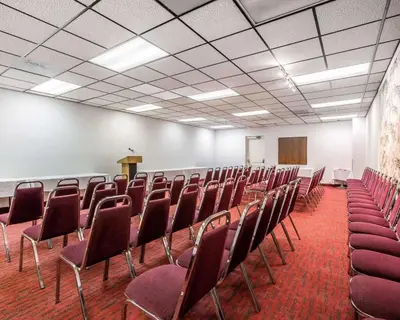 a conference room with chairs and a podium in it at Quality Inn & Suites Montebello - Los Angeles in Montebello