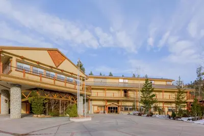 a large building with a parking lot in front of it at Holiday Inn Resort The Lodge at Big Bear Lake by IHG in Big Bear Lake