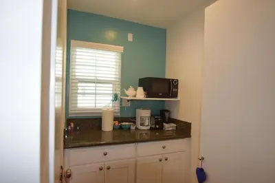 a kitchen with a counter top with a microwave at Venice Beach Apartments Monthly rents in Los Angeles