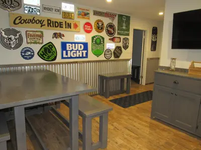 a room with a table and signs on the wall at Monticello in Big Bear Lake