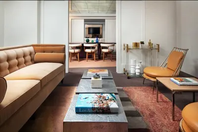 a living room with a couch and a table at SLS Hotel, a Luxury Collection Hotel, Beverly Hills in Los Angeles