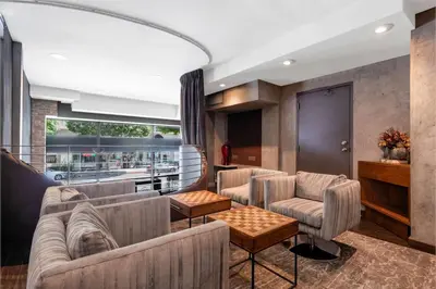 a living room with couches and a table at The O Hotel, Trademark Collection by Wyndham in Los Angeles