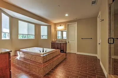 a large bathroom with a tub and a sink at Roomy Home with Deck, 5 Mi to Lake Arrowhead Village in Lake Arrowhead