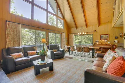 a large living room with couches and a table at Lake Arrowhead Family Home with Game Room in Lake Arrowhead