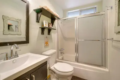 a bathroom with a shower and a toilet and a sink at Lake Arrowhead Family Home with Game Room in Lake Arrowhead