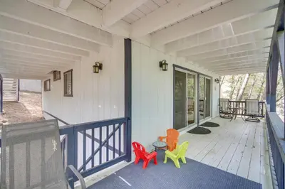 a porch with three chairs and a table on it at Lake Arrowhead Family Home with Game Room in Lake Arrowhead