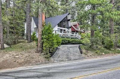 a house on the side of a road at Lake Arrowhead A-Frame House with Private Hot Tub! in Lake Arrowhead
