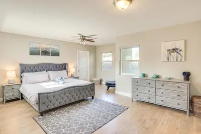 a bedroom with a bed and a dresser at Fullerton Vacation Rental with Private Pool! in Fullerton