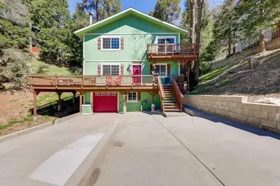 a large house with a deck and a balcony at Remodeled Crestline Retreat Walk to Lake Gregory! in Crestline