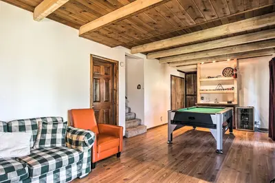 a living room with a pool table and a couch at 5 Mi to Lake Arrowhead Village Cabin with Game Room in Lake Arrowhead