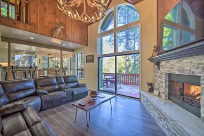 a living room with a couch and a fireplace at Lake Arrowhead Family Home with Deck! in Lake Arrowhead