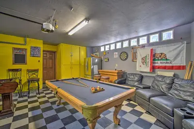 a living room with a pool table in it at Lake Arrowhead Family Home with Deck! in Lake Arrowhead