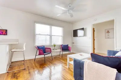 a living room with a couch and chairs at New Beach Jewel Bungalow in Long Beach