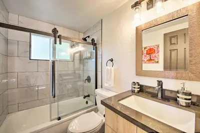 a bathroom with a sink and a shower and a toilet at Bikes and Game Room Lovely Lake Arrowhead Home! in Lake Arrowhead
