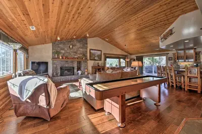 a living room with a ping pong table at Hot Tub, Game Room and 2 Decks Luxe Big Bear Home in Big Bear Lake