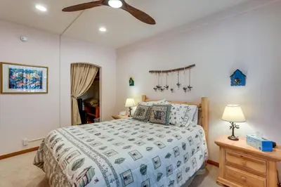 a bedroom with a bed and a ceiling fan at Luxe Lake Arrowhead Home with Deck, 3 Mi to Village! in Lake Arrowhead