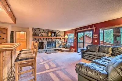 a living room with a couch and a fireplace at Hike, Ski, Fish Big Bear Lake Lodge with Deck in Big Bear Lake