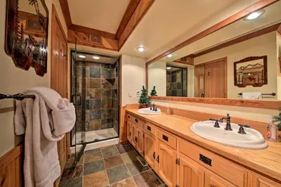 a bathroom with two sinks and a shower at Hike, Ski, Fish Big Bear Lake Lodge with Deck in Big Bear Lake