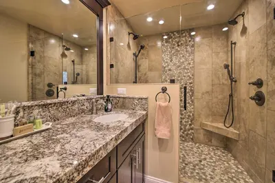 a bathroom with a sink and a shower at Sugar Bear Lodge with Game Room - 5 Mi to Village! in Lake Arrowhead