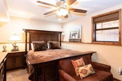 a bedroom with a bed and a ceiling fan at Luxury Lodge-1888 by Big Bear Vacations in Big Bear Lake