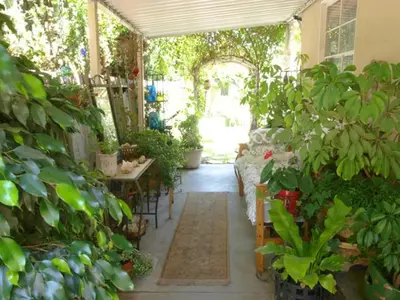 a patio with a bunch of plants and a table at Culver City Escape with Pool, Near Disneyland Park! in Los Angeles