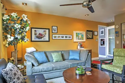 a living room with a couch and a table at Unique Long Beach House with Patio, Grill and Balcony in Long Beach