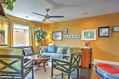 a living room with a couch and a table at Unique Long Beach House with Patio, Grill and Balcony in Long Beach