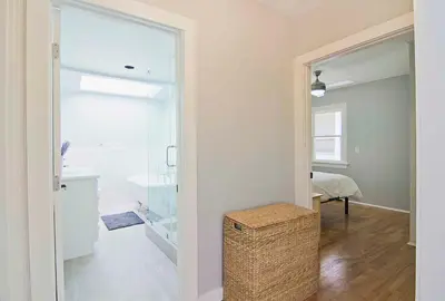 a room with a hallway with a door to a bathroom at Hollywood's Garden Paradise at World Artists Living in Los Angeles