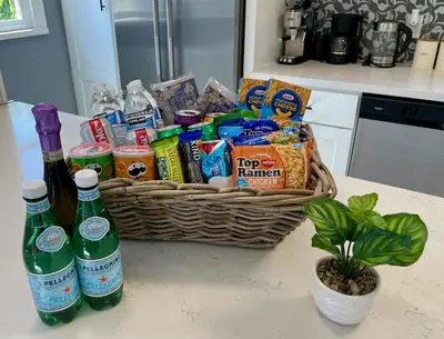 a basket filled with food and drinks on a counter at Hollywood's Garden Paradise at World Artists Living in Los Angeles