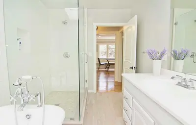 a bathroom with a shower and a sink and a toilet at Hollywood's Garden Paradise at World Artists Living in Los Angeles
