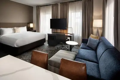 a hotel room with a bed and a couch at Residence Inn Los Angeles Glendale in Glendale