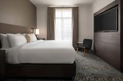 a hotel room with a bed and a television at Residence Inn Los Angeles Glendale in Glendale