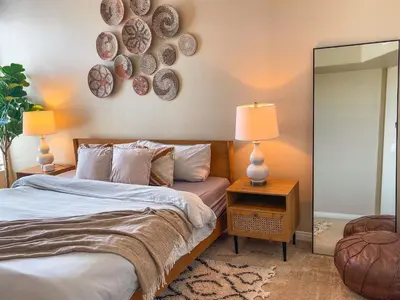 a bedroom with a bed and two lamps and a mirror at Sunny 1BDR centrally located in Marina del Rey in Los Angeles