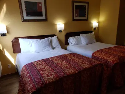 two beds in a hotel room next to each other at Providencia Motel in Burbank