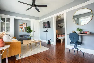 a living room with blue walls and a ceiling fan at Pet-Friendly Stay, Mins to Beach, Conv Ctr, Prkg LB B in Long Beach