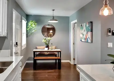 a dining room with a table and a mirror at Traveler's Pick Cozy, Near Beach & Dtwn,Prkg LB C in Long Beach
