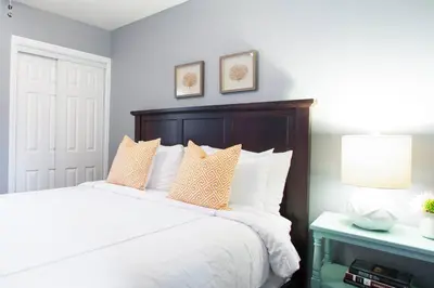 a bedroom with a large white bed with pillows at Traveler's Pick Cozy, Near Beach & Dtwn,Prkg LB C in Long Beach