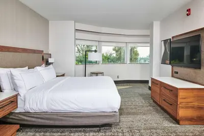 a hotel room with a bed and a flat screen tv at Doubletree By Hilton Fullerton in Fullerton