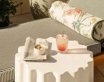 a white table with a drink on top of it at The Hoxton, Downtown LA in Los Angeles