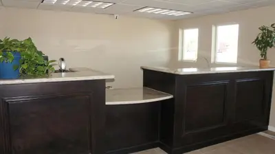 a kitchen with a sink and a counter top at Apple Valley Hotel & Lodge in Apple Valley