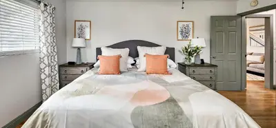 a bedroom with a large bed with orange pillows at Top Pick Apartment Near Grocery Store Parking CCD in Culver City