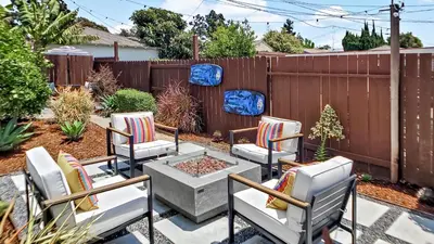 a patio with chairs and a fire pit in a backyard at Top Pick Apartment Near Grocery Store Parking CCD in Culver City