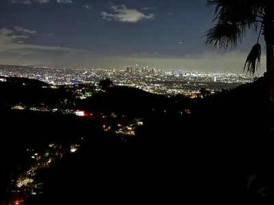 a view of a city lit up at night at HOLLYWOOD HILLS JETLINER VIEWS at STUDIO 1080 HOLLYWOOD in Los Angeles