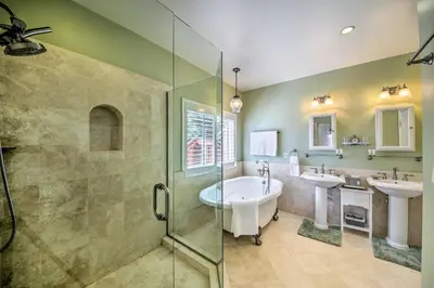 a bathroom with two sinks and a tub and a shower at Mountain Gem with Game Room, 5 Mi to Lake Arrowhead! in Lake Arrowhead