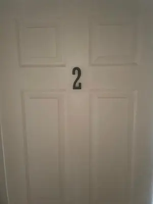 a white door with the number two on it at Home Sweet Home in Colton