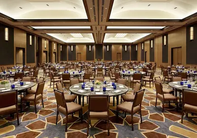 a large banquet hall with tables and chairs at Luskin Hotel in Los Angeles